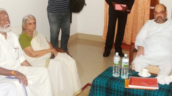 Poet Sugathakumari meeting with BJP national president Amit Shah in Thiruvananthapuram on Monday.  State general secretary of the Hindu Aikya Vedi Kummanam Rajasekharan is also seen| Express