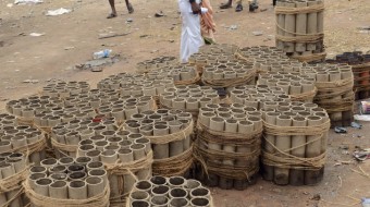 Fire cracker shells are kept stacked near the spot where a massive fire broke out during a fireworks display at the Puttingal temple complex in Paravoor village, Kollam district, southern Kerala state, India, Sunday, April 10, 2016. Dozens were killed and many more were injured when a spark from an unauthorized fireworks show ignited a separate batch of fireworks that were being stored at the temple complex, officials said.(AP Photo/ Jyothiraj. N.S)